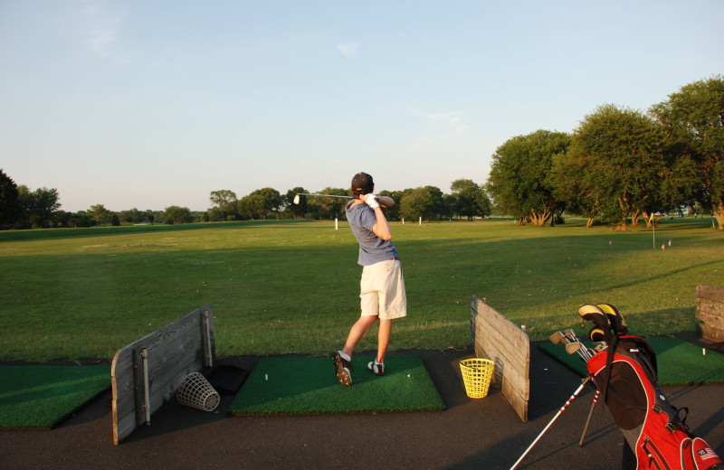 Playing golf near Southampton Inn.