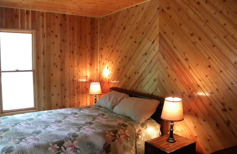 Cabin bedroom at Crane Lake Wilderness Lodge.