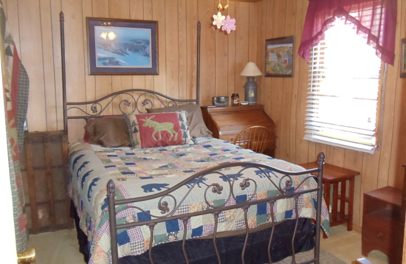 Cabin bedroom at Bear Trail Cabins.