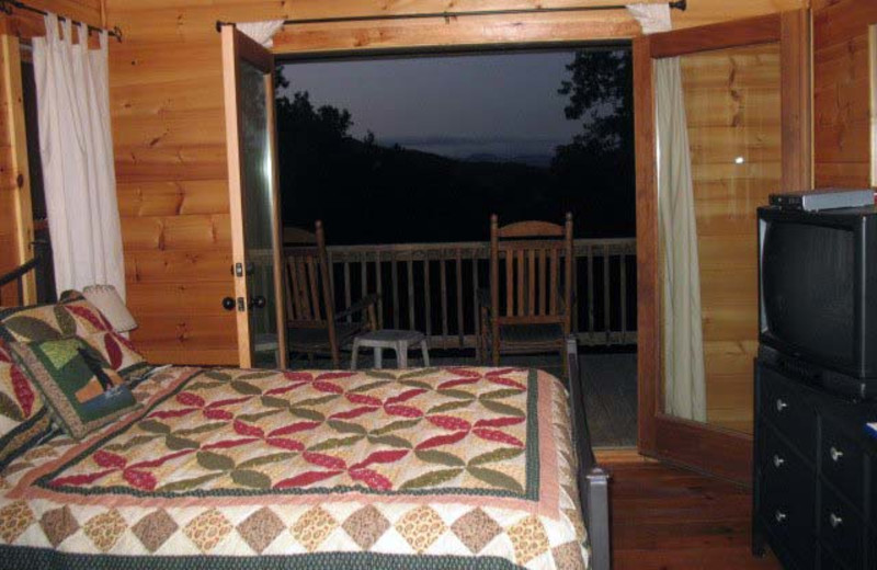 Cabin bedroom at Black Bear Cabin Rentals.