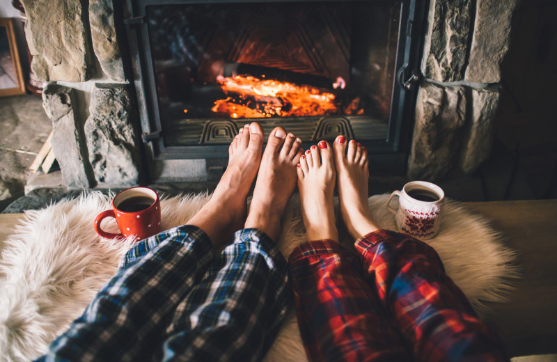 Couple by fire at Kiamichi Country Cabins.