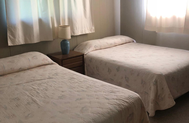 Cabin bedroom at Dogtooth Lake Resort.