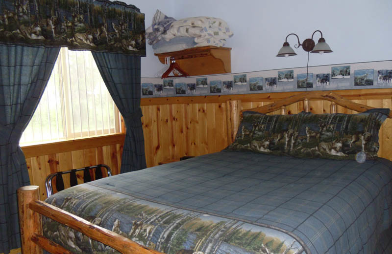 Cabin bedroom at Glaciers' Mountain Resort.