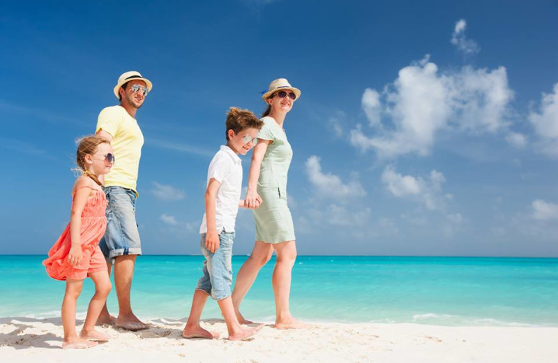 Family on beach at The Sofia Hotel.