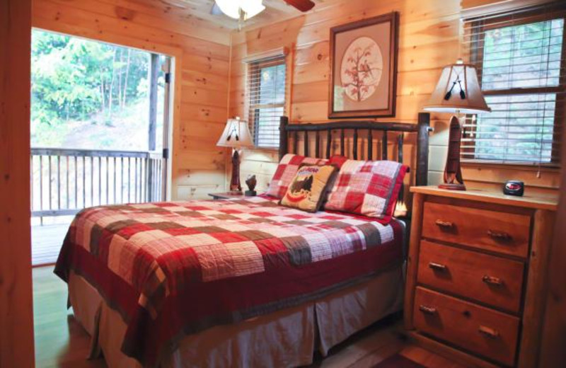 Cabin bedroom at Mountain Getaway Cabin Rentals.