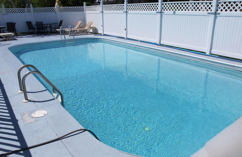 Outdoor pool at Mackenzie's Cottages, Motel & Suites.