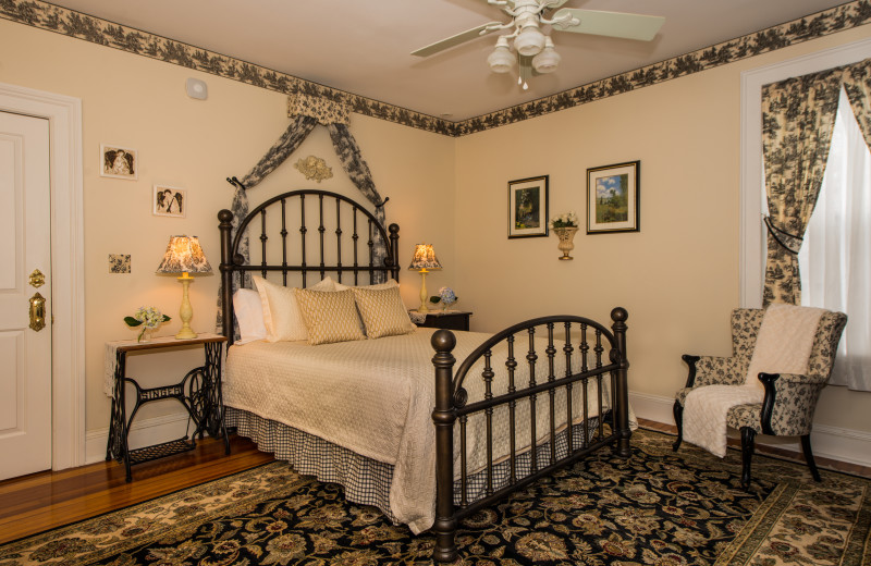 Offers a bold queen-size iron bed, a quaint Victorian accent chair and a fireplace. The Clement Room is tastefully decorated in Victorian cream and black toil ‘e. En suite bath features an antique claw foot tub/shower.