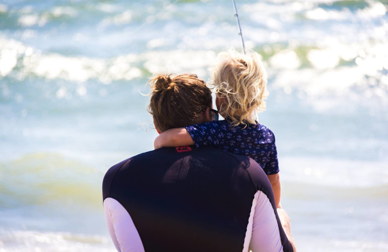 Family on beach at Realty World - First Coast Realty.