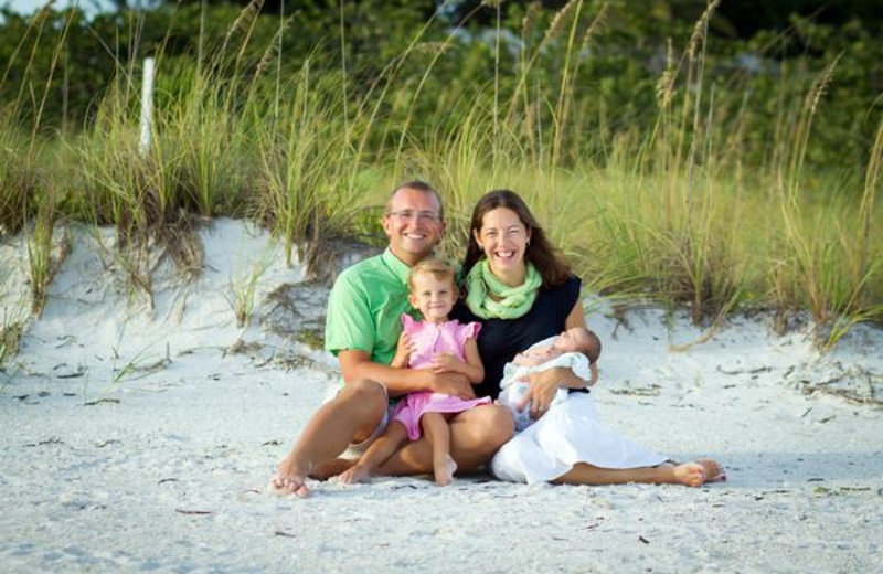 Family on beach at Lizzie Lu's Island Retreat.