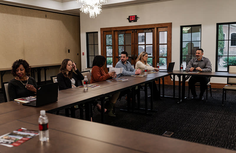 A team of business leaders carry out a focus group.