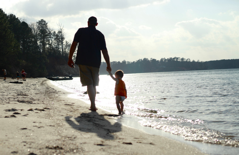 Family on beach at BoatHouse Villa.