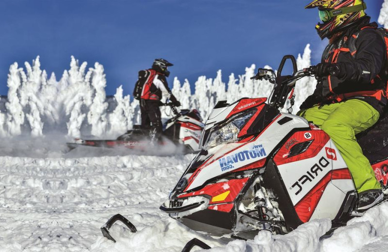 Snowmobiling at Glacier House Resort.