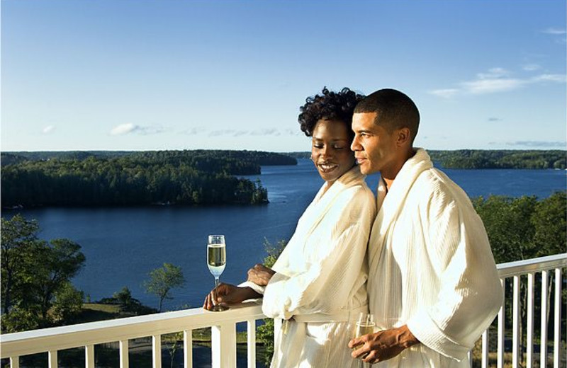 Couple on balcony at The Rosseau, A JW Marriott Resort & Spa.