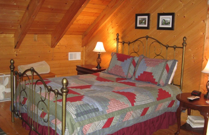 Cabin bedroom at Cabins at Highland Falls.