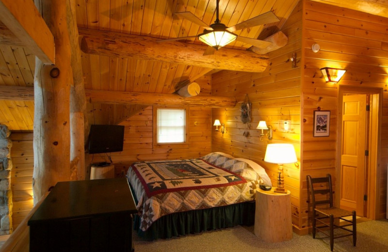 Cabin bedroom at Trout House Village Resort.