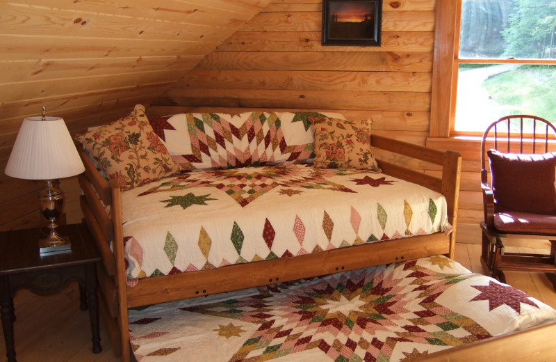 Cabin bedroom at Creeks Crossing Cabins.