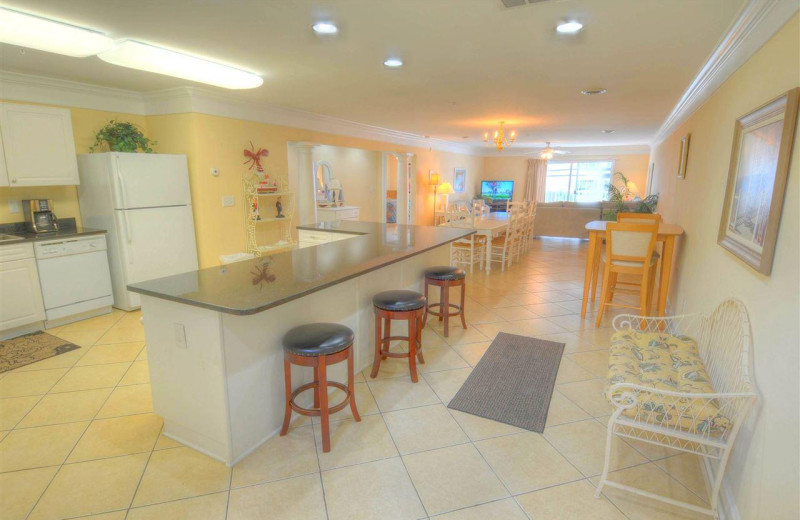 Rental kitchen at CondoLux Vacation Rentals.