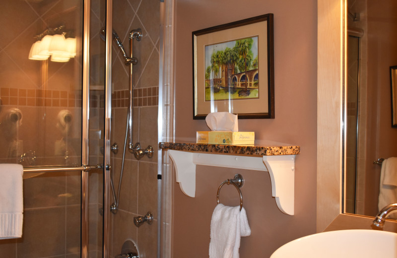 Bathrooms at the Inlet Sports Lodge featuring luxurious details such as granite countertops, sink bowls and showers with massaging body jets. 