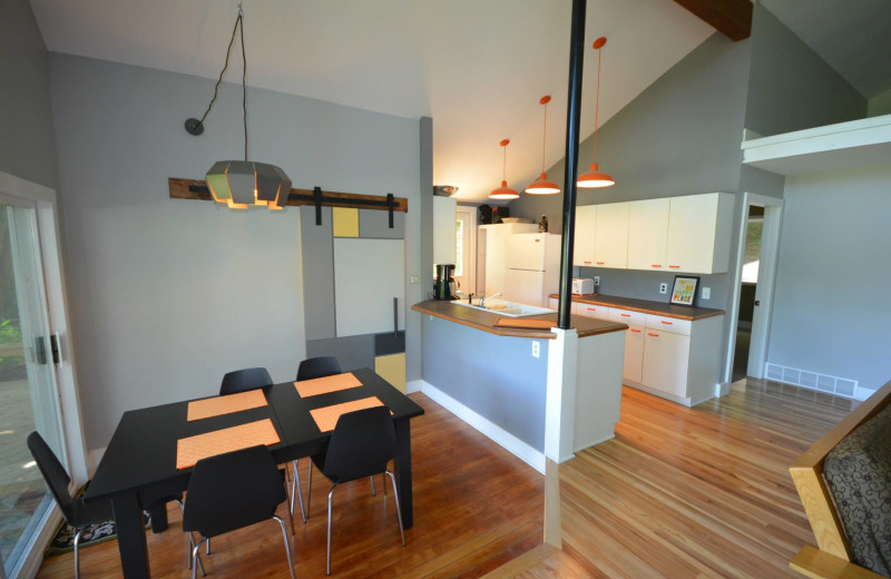 Rental kitchen and dining area at Visit Up North Vacation Rentals.