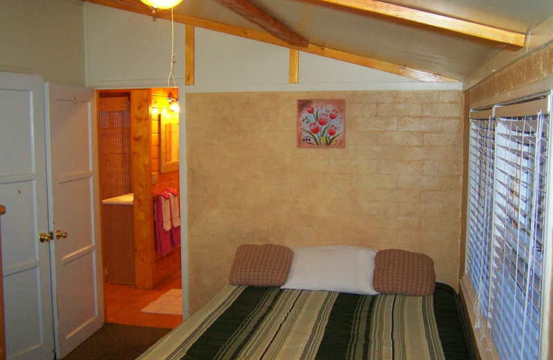 Cabin bedroom at Golden Bear Cottages Resort.