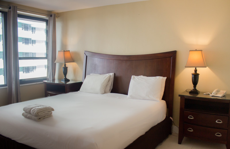 Guest bedroom at The Alexander All Suite Oceanfront Resort.