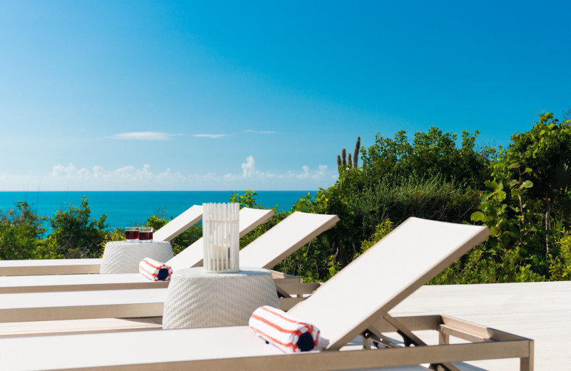 Pool chairs at Villa Sol Y Luna.