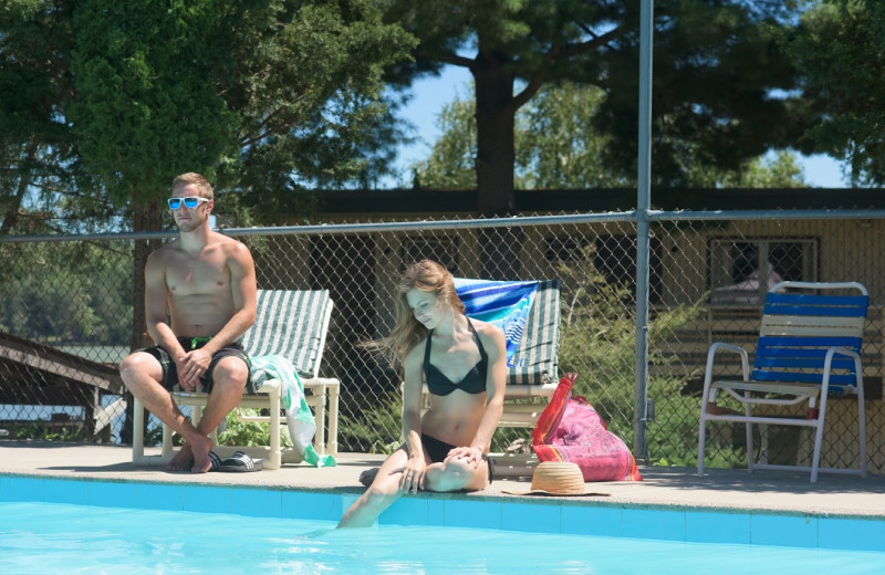 Relaxing by the pool at Delton Oaks Resort.