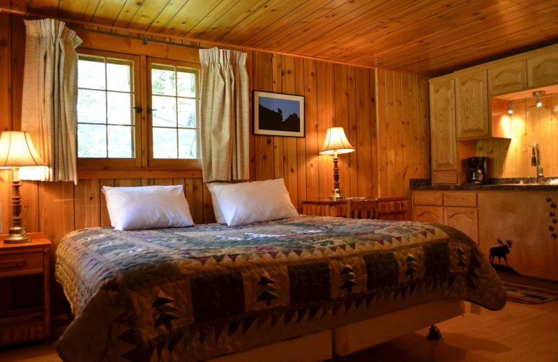 Cabin bedroom at Shoshone Lodge & Guest Ranch.