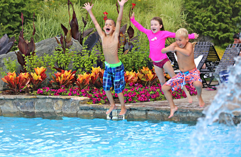 Kids jumping in pool at Minerals Hotel.