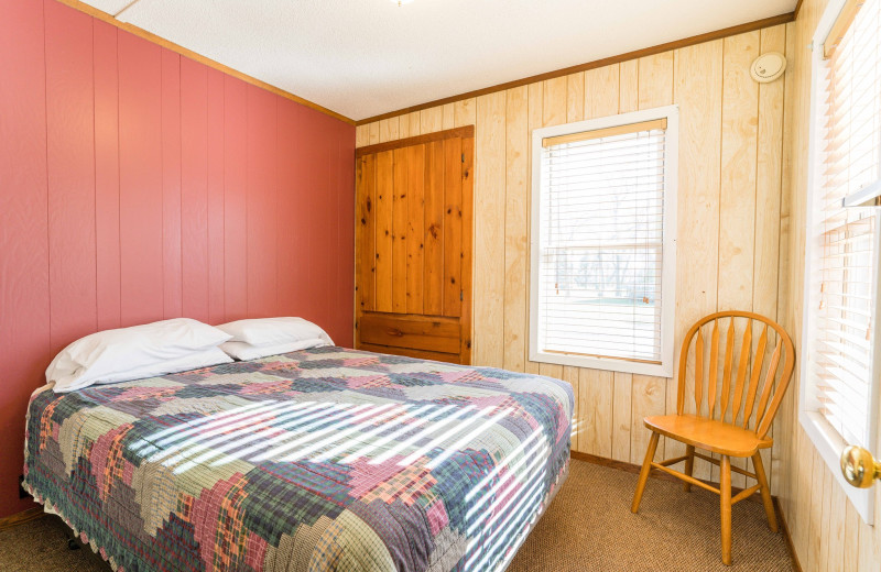 Cabin bedroom at Otter Tail Beach Resort.