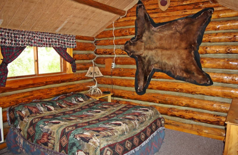 Cabin bedroom at Absaroka Mountain Lodge.