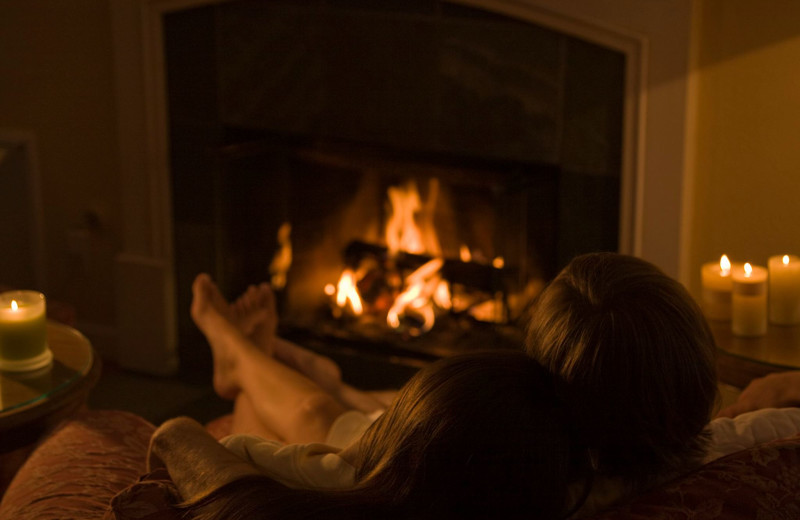 Couple by fireplace at Cottage Grove Inn.