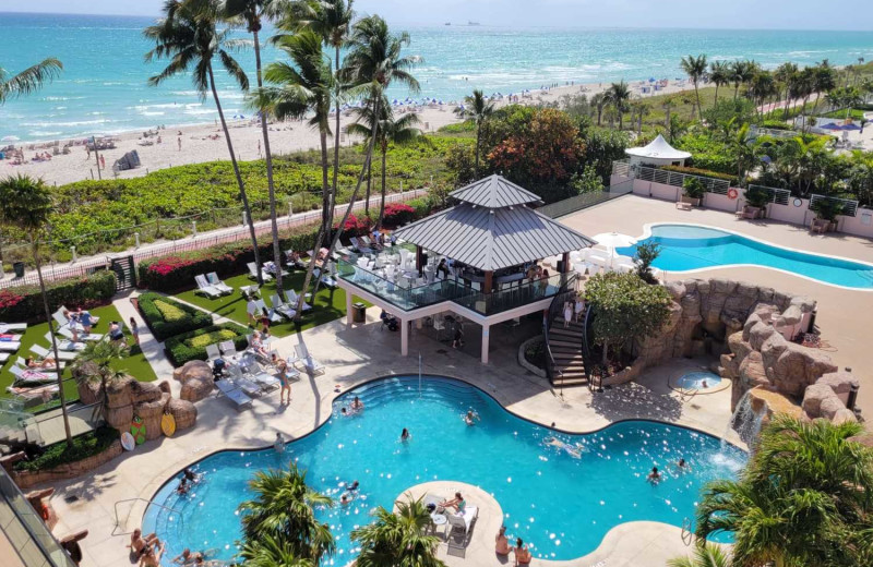 Outdoor pool at HORA Vacation Rentals.