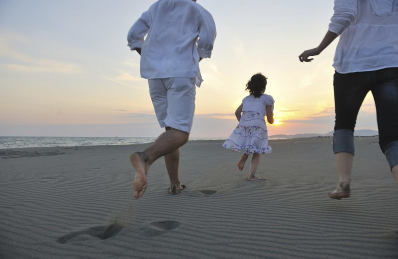 Family on beach at Shangri La Motel.