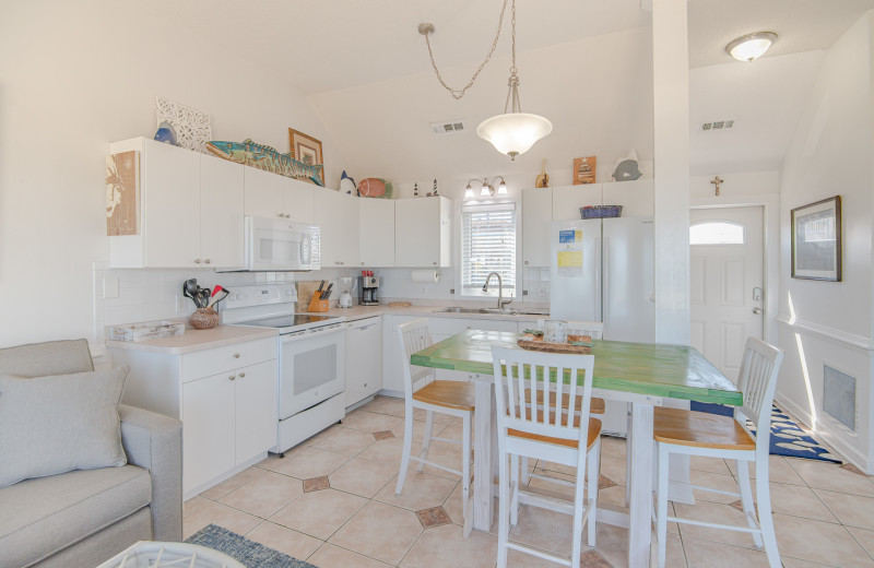 Rental kitchen at Joe Lamb Jr. & Associates Vacation Rentals.