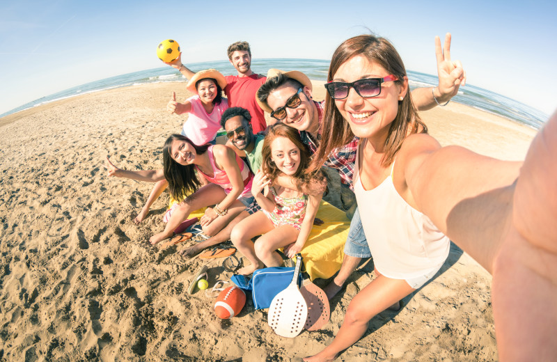 Group on beach at Sugar Sands Realty & Management.