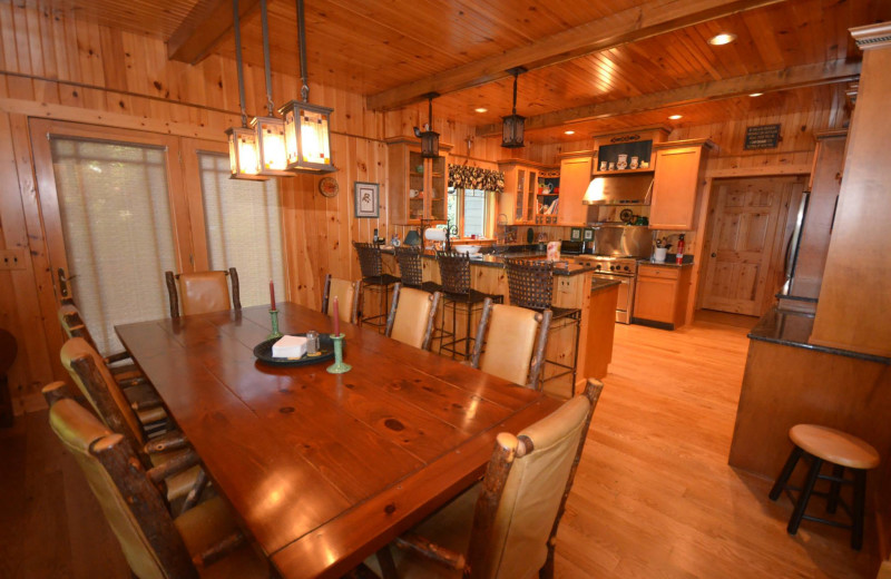 Rental kitchen and dining room at Visit Up North Vacation Rentals.