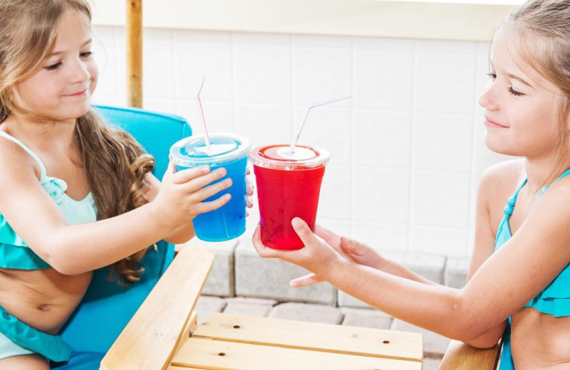 Kids with drinks at Great Blue Resorts- McCreary's Beach Resort.