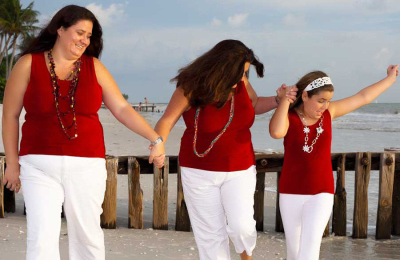 Family on beach at CNE Vacation Rental.