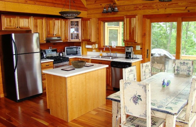 Cabin kitchen at Great Smokys Cabin Rentals.