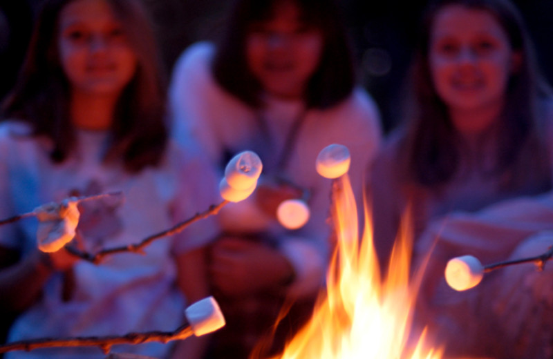 Roasting marshmallows at The Woods At Bear Creek Glamping Resort.