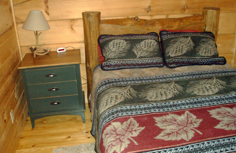 Cabin bedroom at Big Bear Log Cabins.