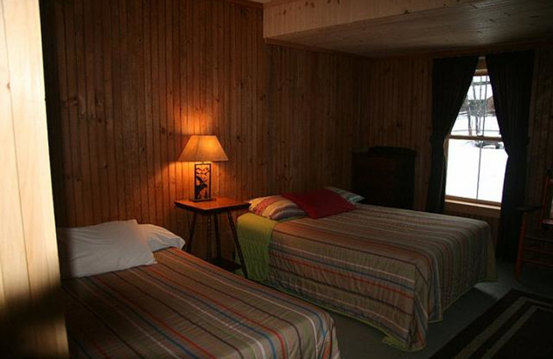 Cabin bedroom at Bald Mountain Camps Resort.