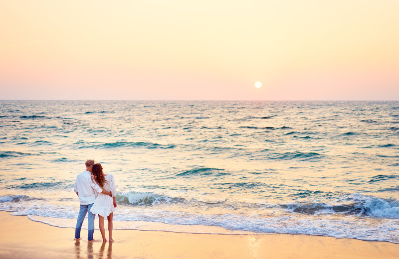 Couple on beach at Ocean Walk Hotel.