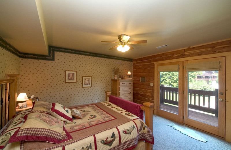 Cottage bedroom at Norfork Resort & Trout Dock.