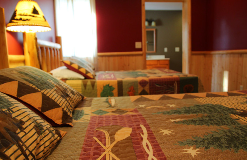 Cabin bedroom at Auger's Pine View Resort.