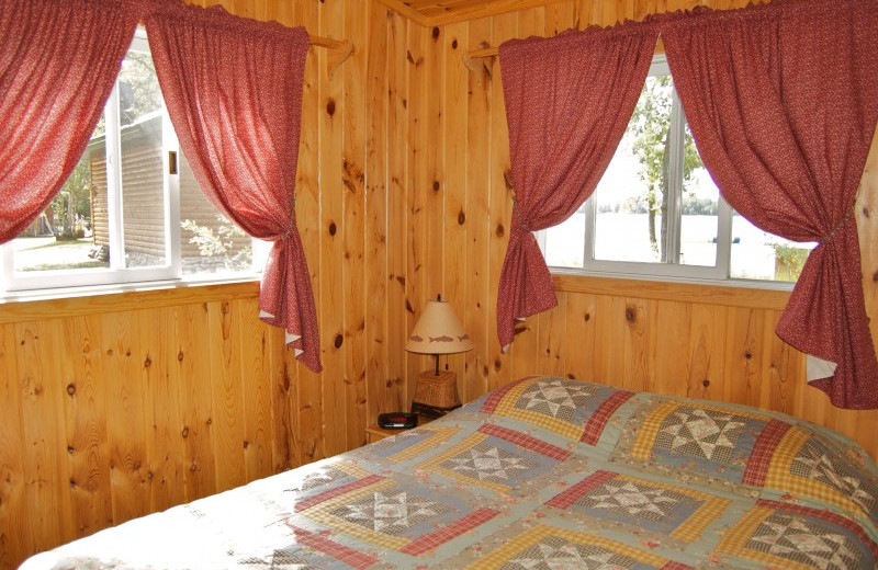 Cabin bedroom at Bear Paw Resort.