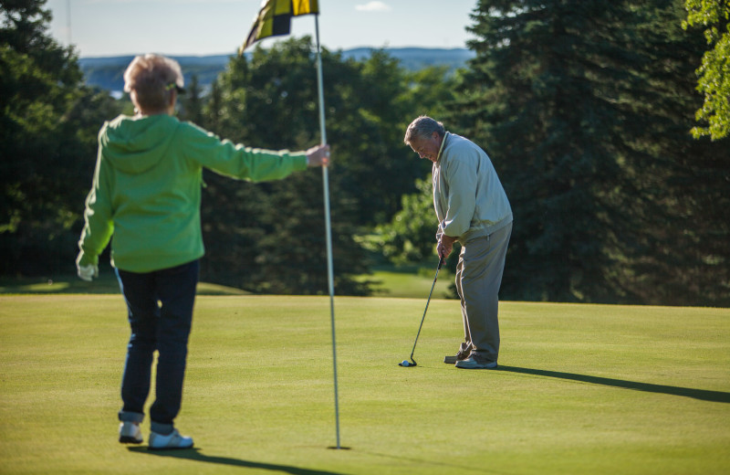 Playing a round of golf at Evergreen Resort.