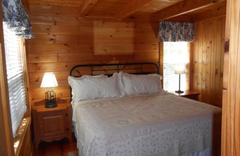 Cabin bedroom at Cabins at Highland Falls.