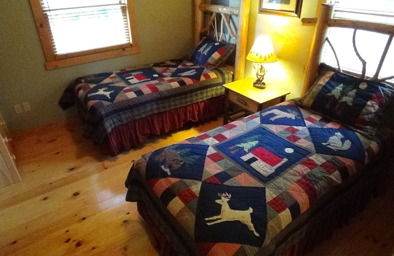 Guest bedroom at Ampersand Bay Resort & Boat Club's Cabin Rentals.